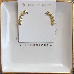 Kendra Scott Carters ear climbers in gold.